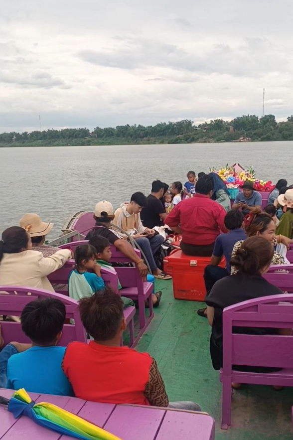 Tourists riding the Dream Garden pink boat on the Mekong River, showing the success of the marketing strategy.