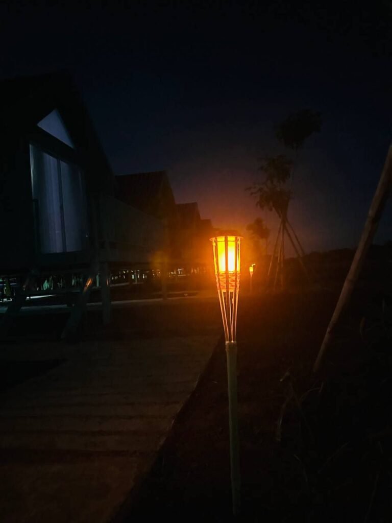 A close-up of our handmade bamboo lights. Simple, affordable, and guests love the warm glow.