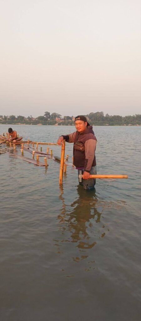 This is me in the early days of Dream Garden. We couldn't afford a construction crew to build the water walkways, so I grabbed a hammer and went into the water myself. It wasn't glamorous, but it saved us the budget we needed to survive.